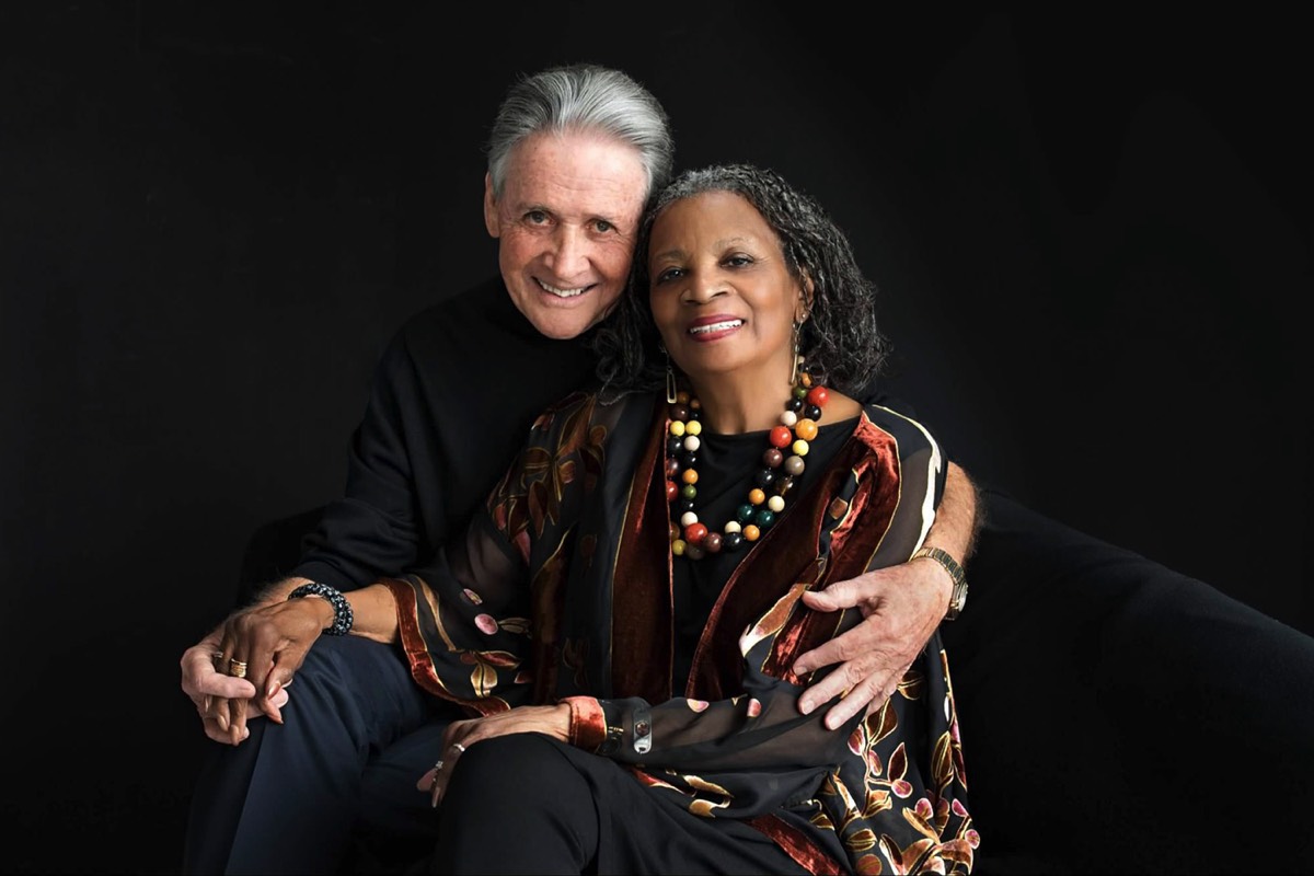 Portrait of a couple against a black background